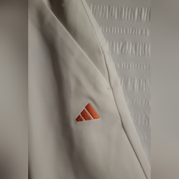 NWT Adidas golf or tennis skort. Front pockets.  White.  Orange logo. Size Small - Picture 3 of 7